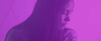 still from "Broken Brain" film shows Penny in purple light