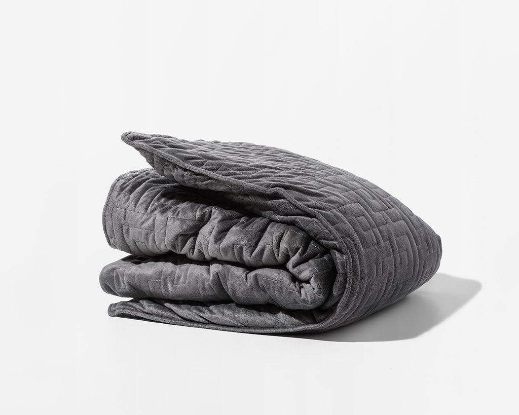 Grey Gravity Blanket folded in a square on a white background