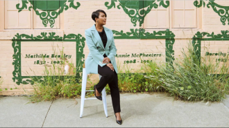 Mayor Keisha Lance Bottoms in front of mural